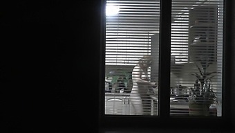 A Voyeur Neighbor Caught Sight Of A Naked Woman Cooking For Her Husband Through An Open Window